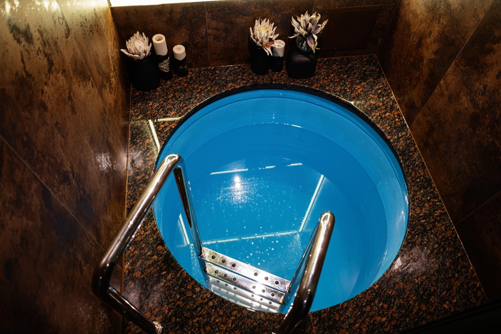 Luxurious,round,plunge,pool,interior,showcasing,granite,finishes,and,contemporary